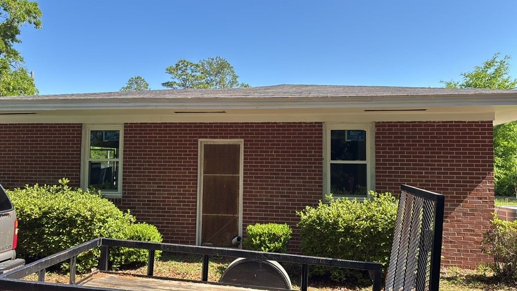 White windows in red brick