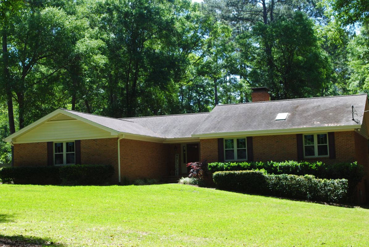 Traditional brick ranch with white twin units