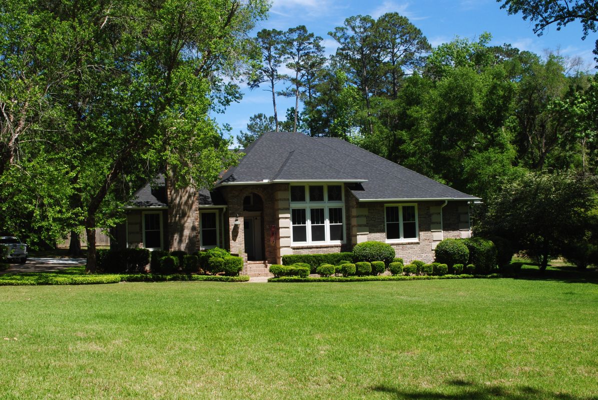 White windows in light beige brick